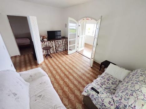 Foto 4 do(a) Casa de 4 quartos à venda em Jardim Porto Novo, Caraguatatuba