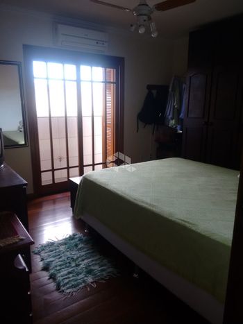 Foto 39 do(a) Casa de 4 quartos à venda em Santa Maria Goretti, Porto Alegre