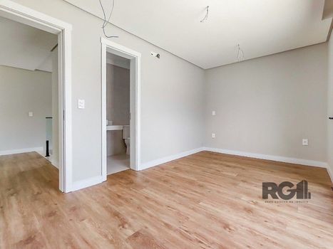 Foto 24 do(a) Casa em Condomínio de 4 quartos à venda em Vila Nova, Porto Alegre
