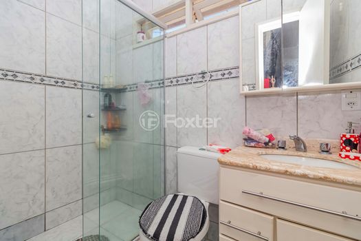 Foto 18 do(a) Casa em Condomínio de 3 quartos à venda em Vila Nova, Porto Alegre