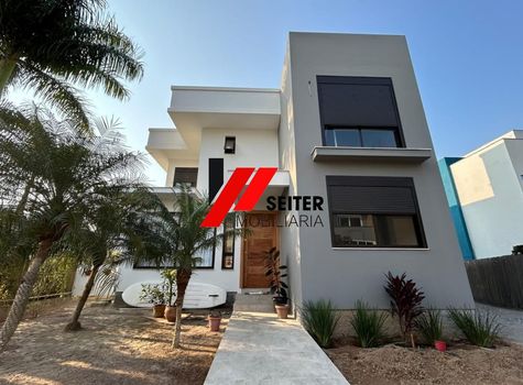 Foto 2 do(a) Casa de 4 quartos à venda em Ponta das Canas, Florianópolis