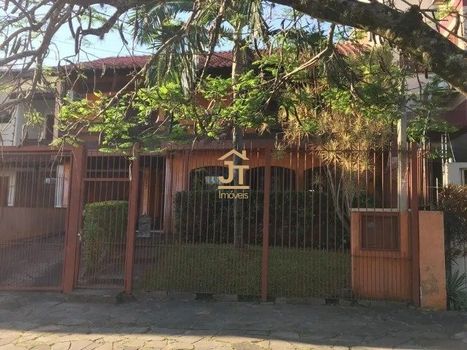 Foto 2 do(a) Casa de 3 quartos à venda em Chácara das Pedras, Porto Alegre