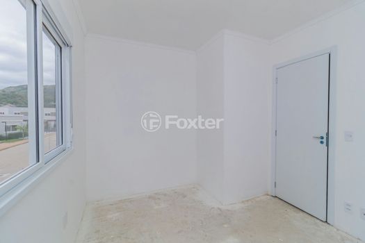 Foto 17 do(a) Casa em Condomínio de 2 quartos à venda em Vila Nova, Porto Alegre