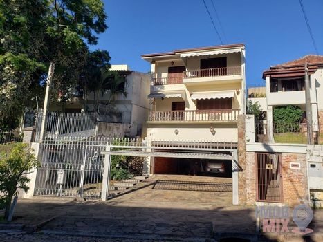 Foto 1 do(a) Casa de 5 quartos à venda em Santo Antônio, Porto Alegre